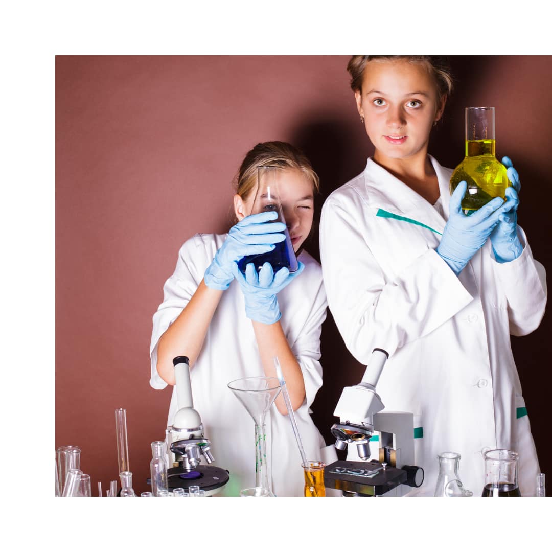 image of girls using science equipment for Science Experiments for Teens at home. From AriseHomeEducation.com