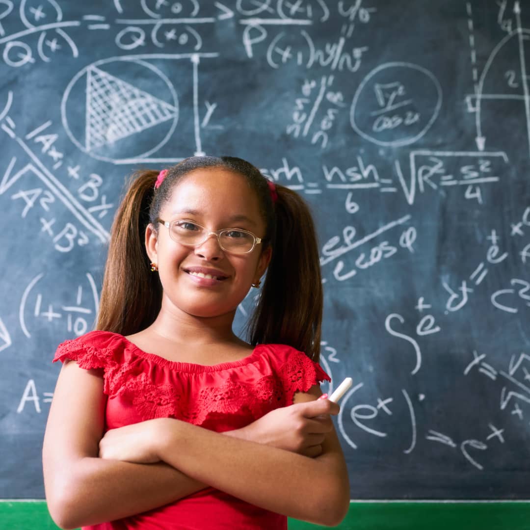 image of teen with chalkboard full of Famous Math Problems for Teens from AriseHomeEducation.com